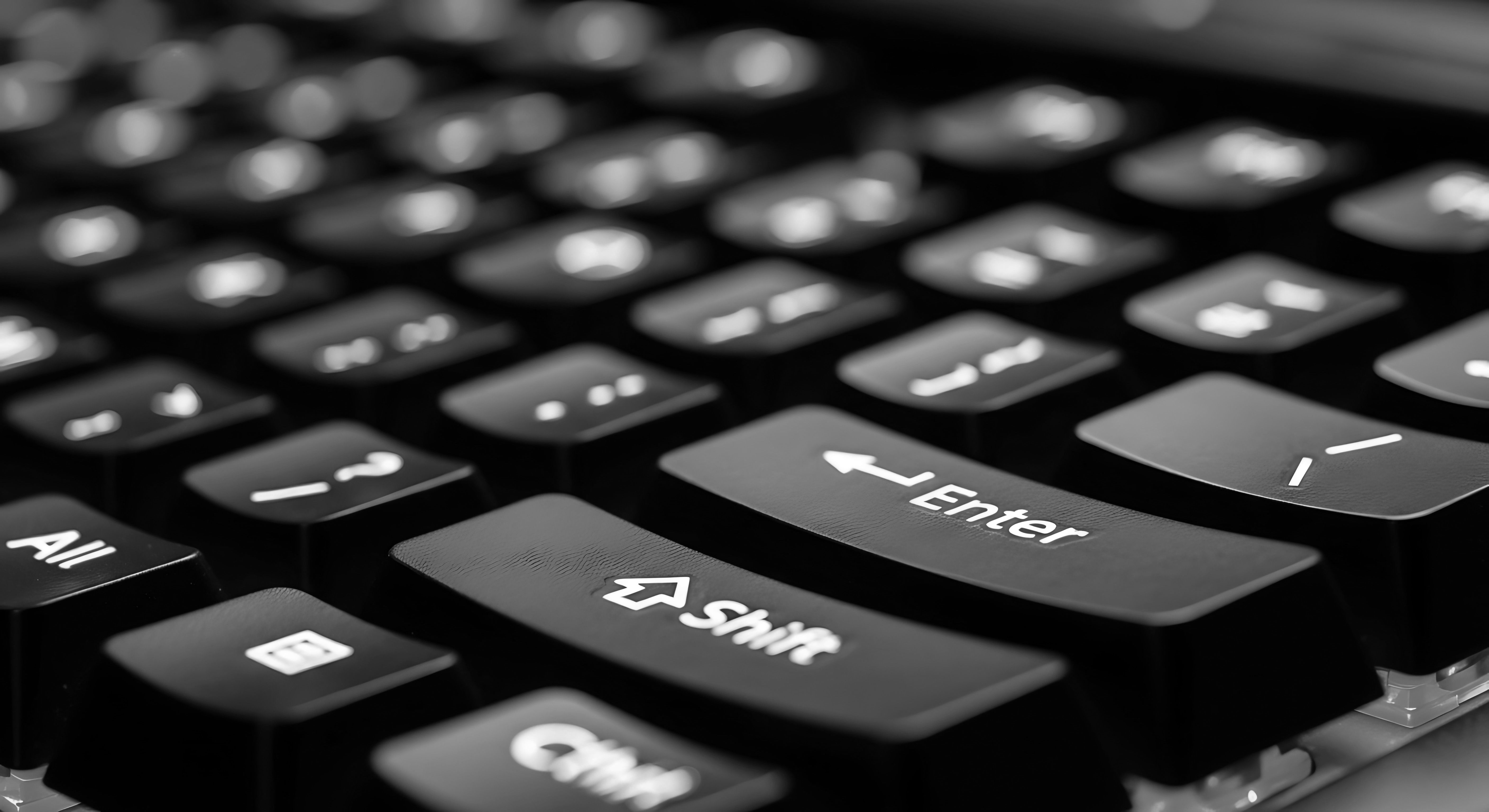 A close-up of a computer keyboard, shot from a low, macro-level angle.